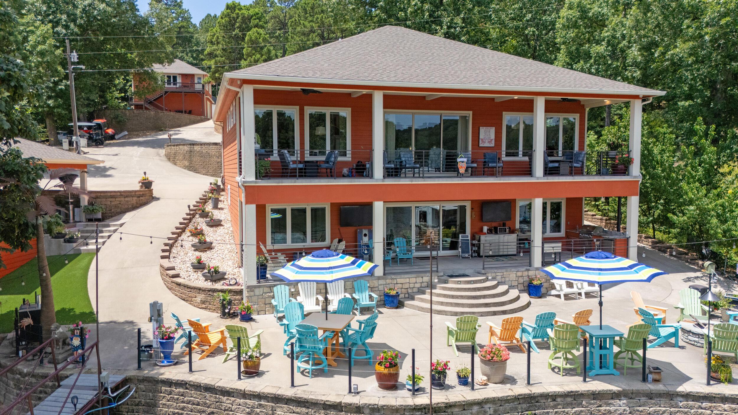 Image 1: lakeside view of home and outdoor entert