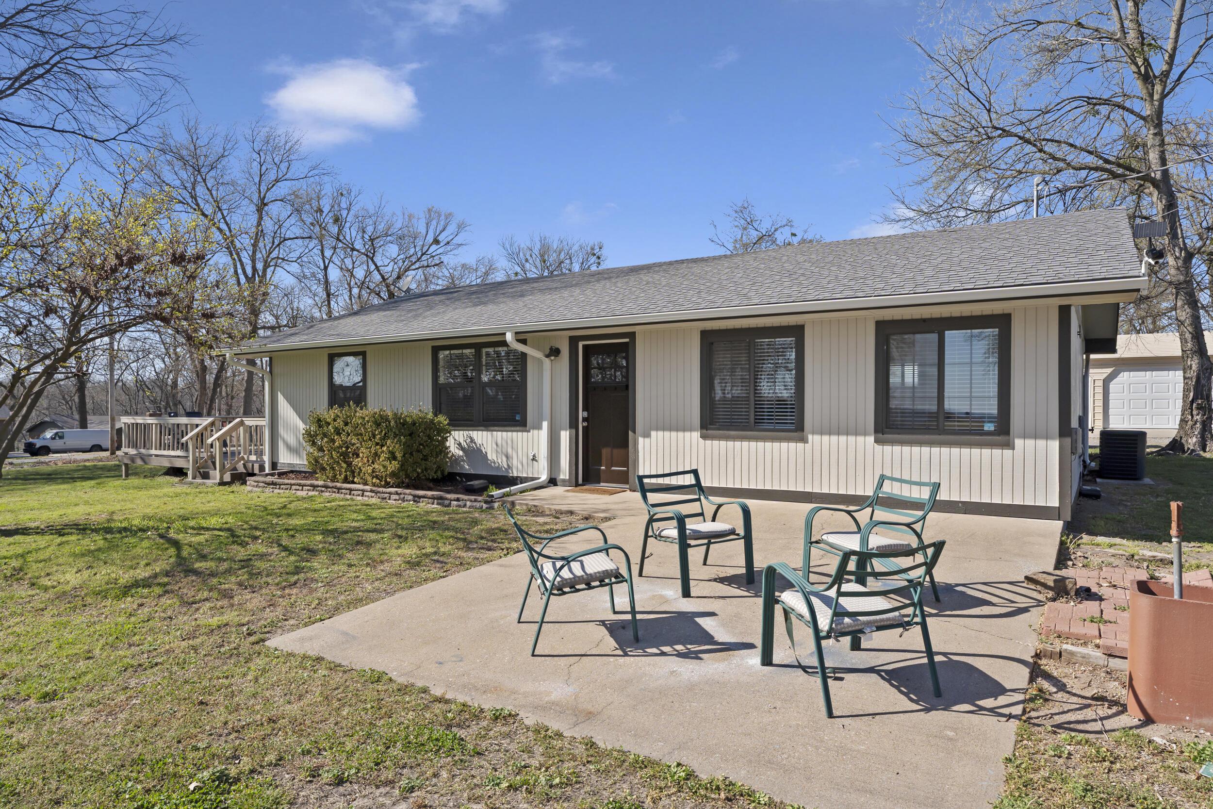 Image 2: Front Exterior & Patio