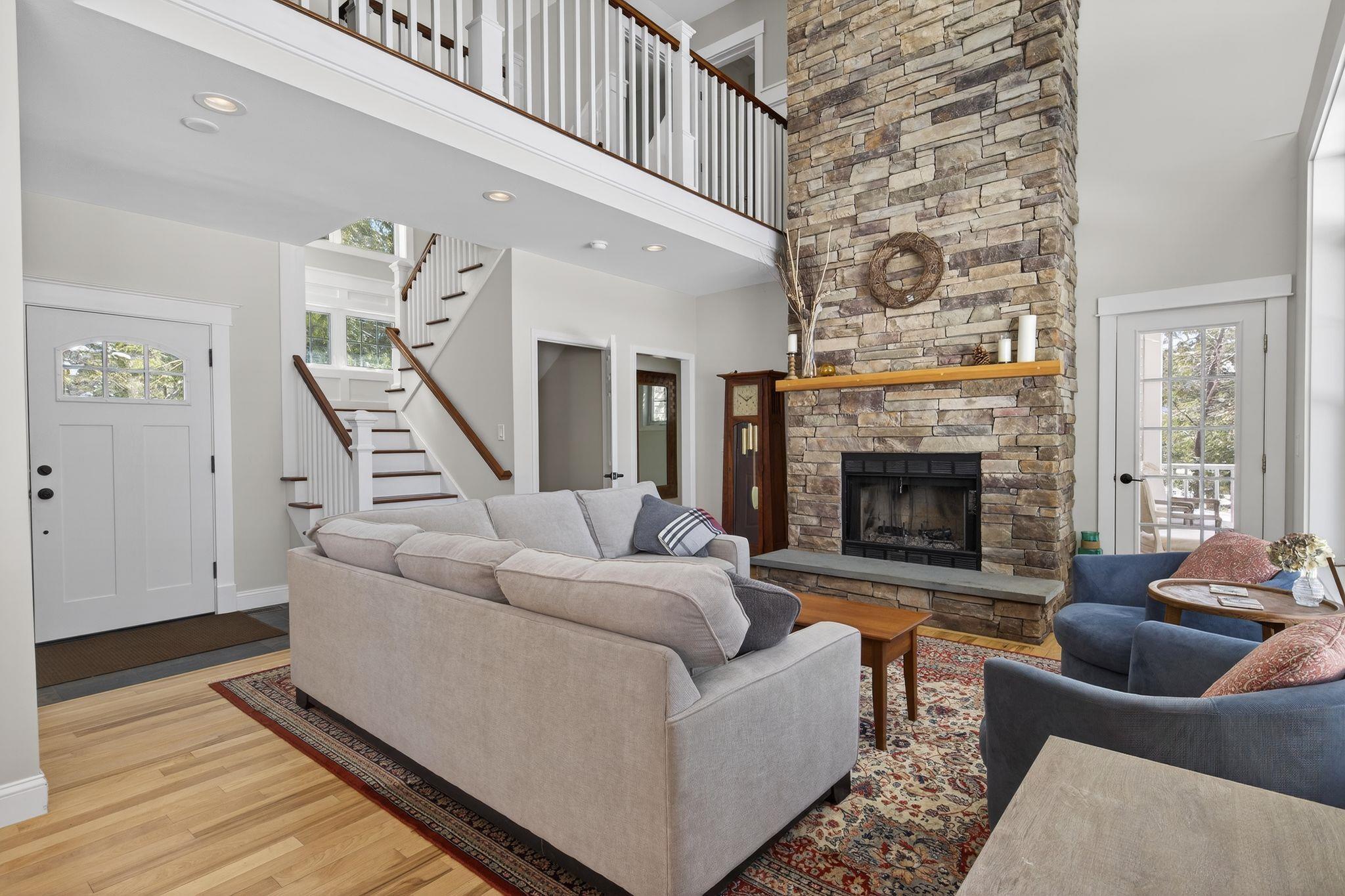 Image 4: Gorgeous cathedral ceiling and fireplace