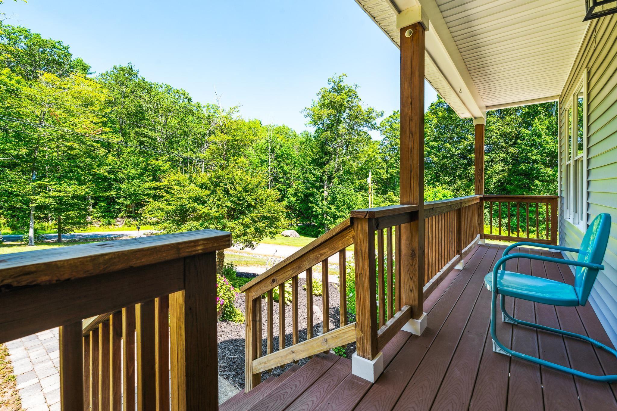 Image 3: Beautiful Front Porch to enjoy the manicured lawns