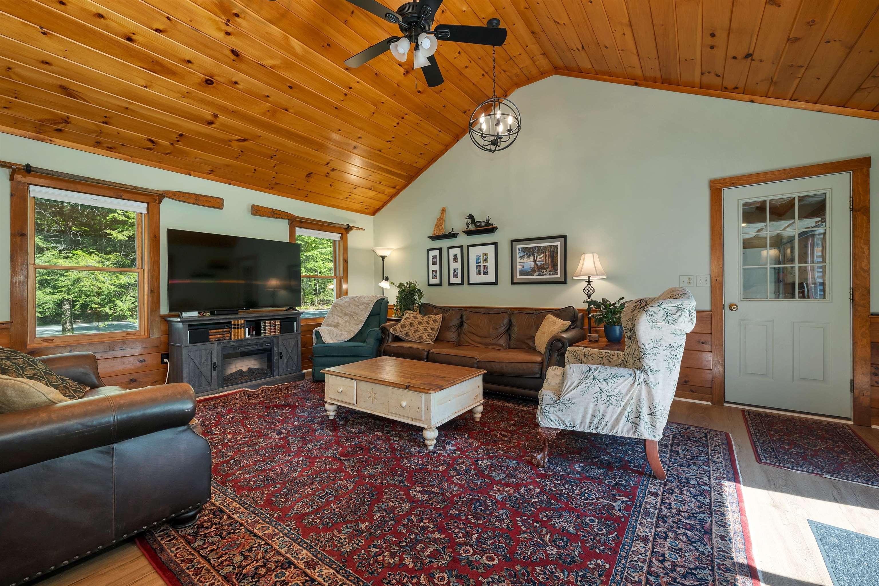 Image 2: A warm, vaulted great room made for gathering