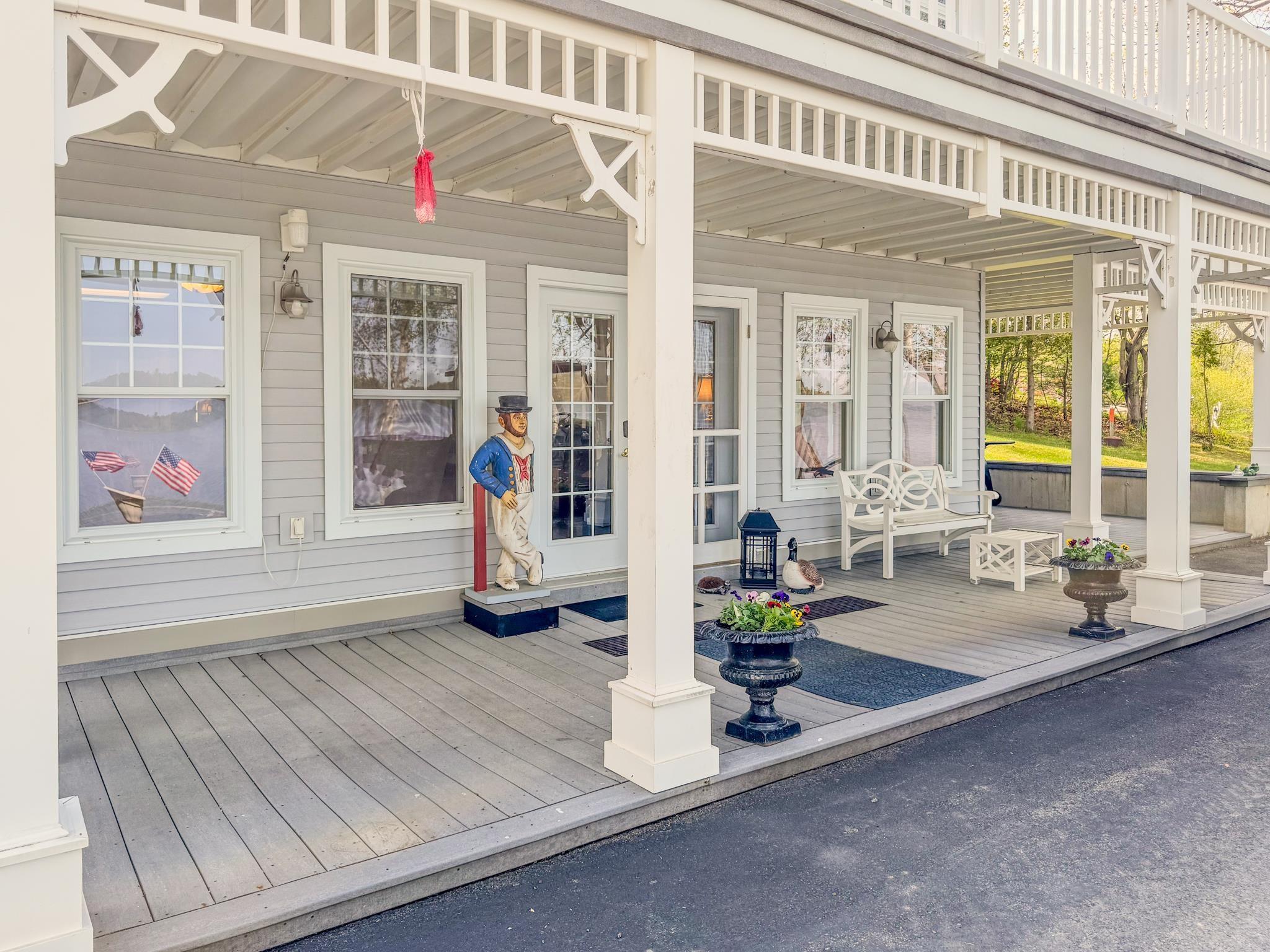 Image 2: Inviting porches to enjoy the serene lake views...