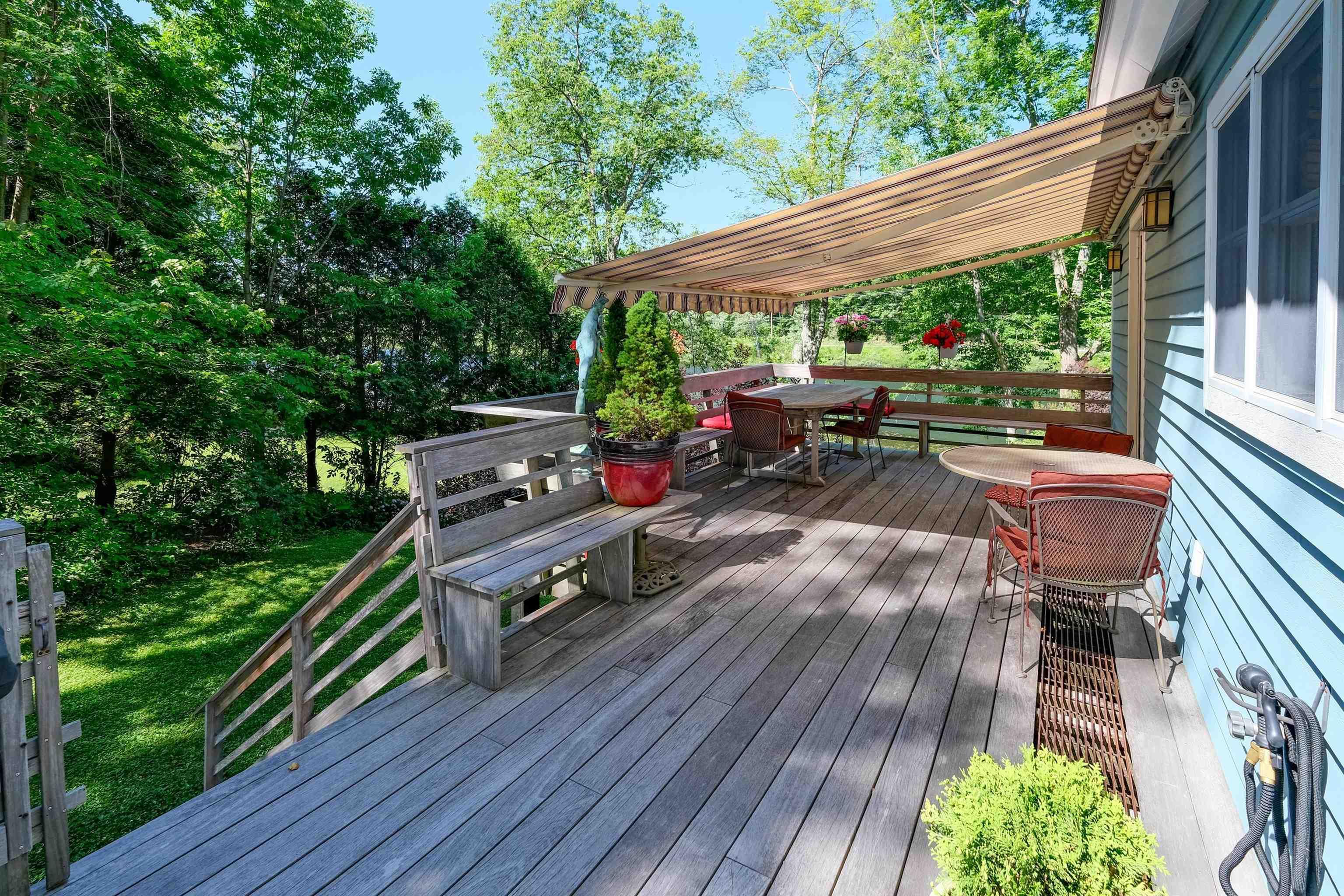 Image 2: epi wood deck with electric awning