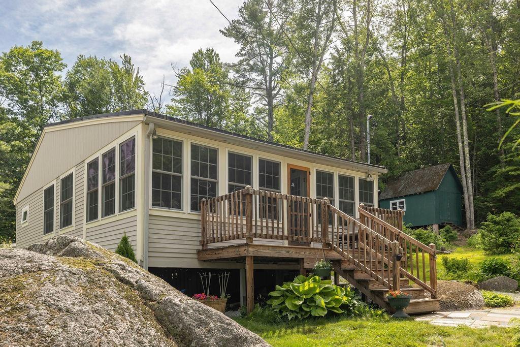 Image 3: Seasonal cottage with mature plantings and perennial gardens