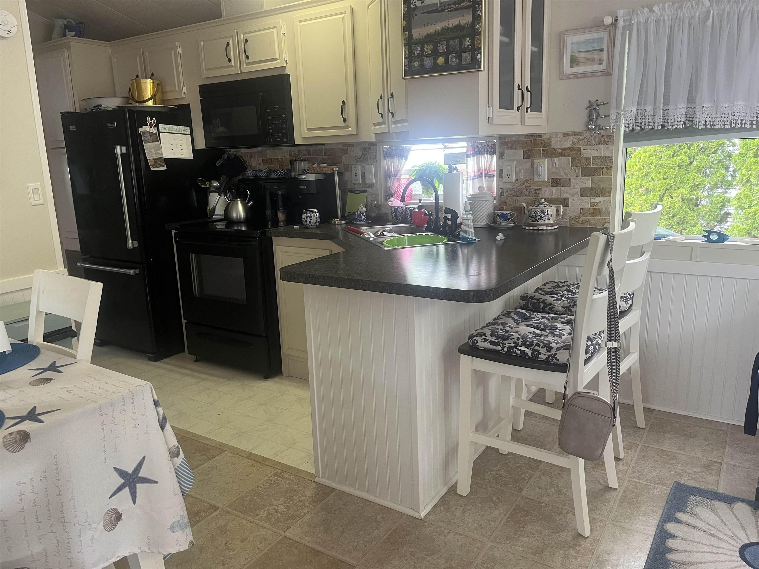 Image 1: Newer Kitchen with breakfast bar