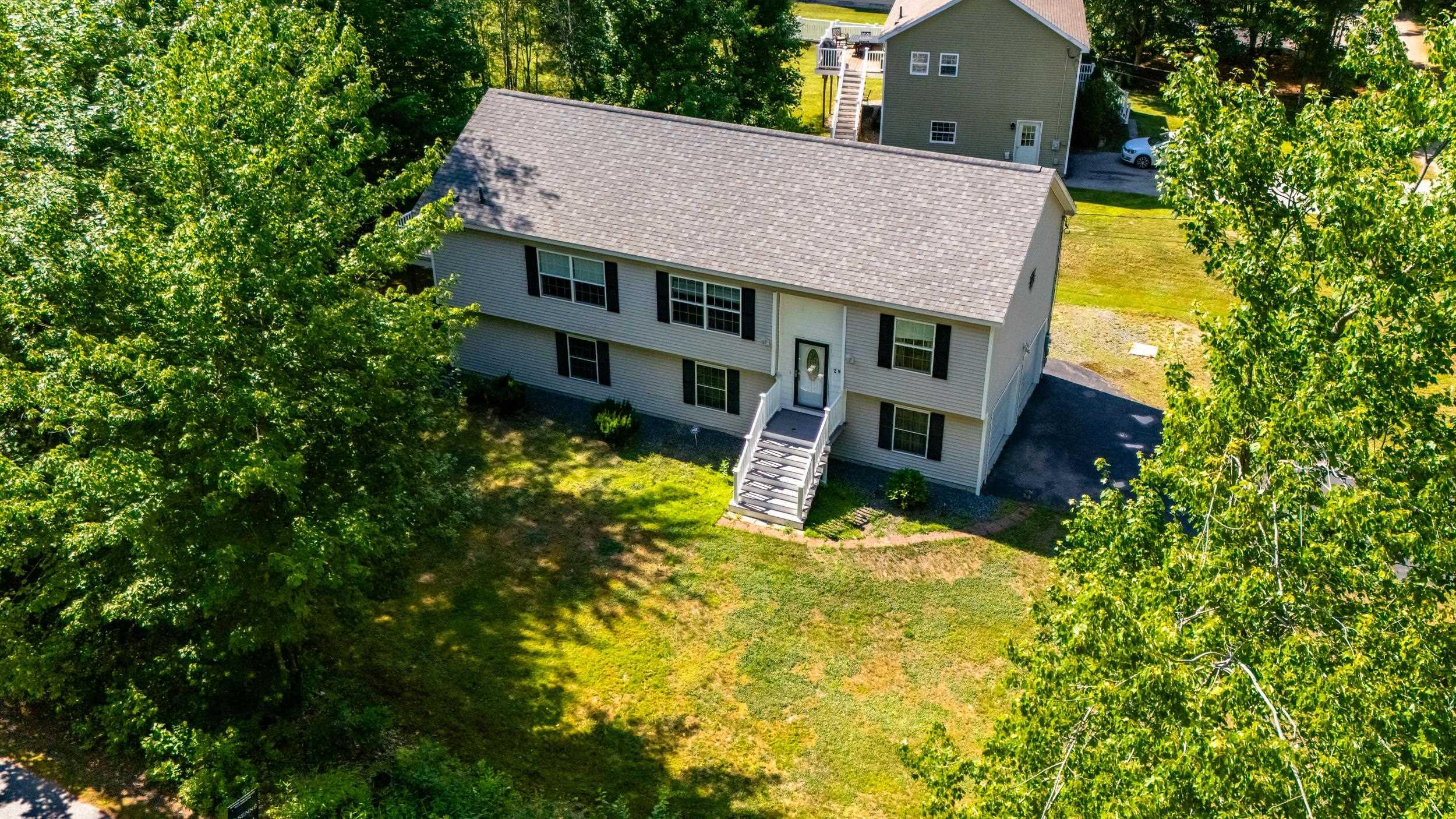 Image 0: WELL MAINTAINED TWO LEVEL OSSIPEE HOME