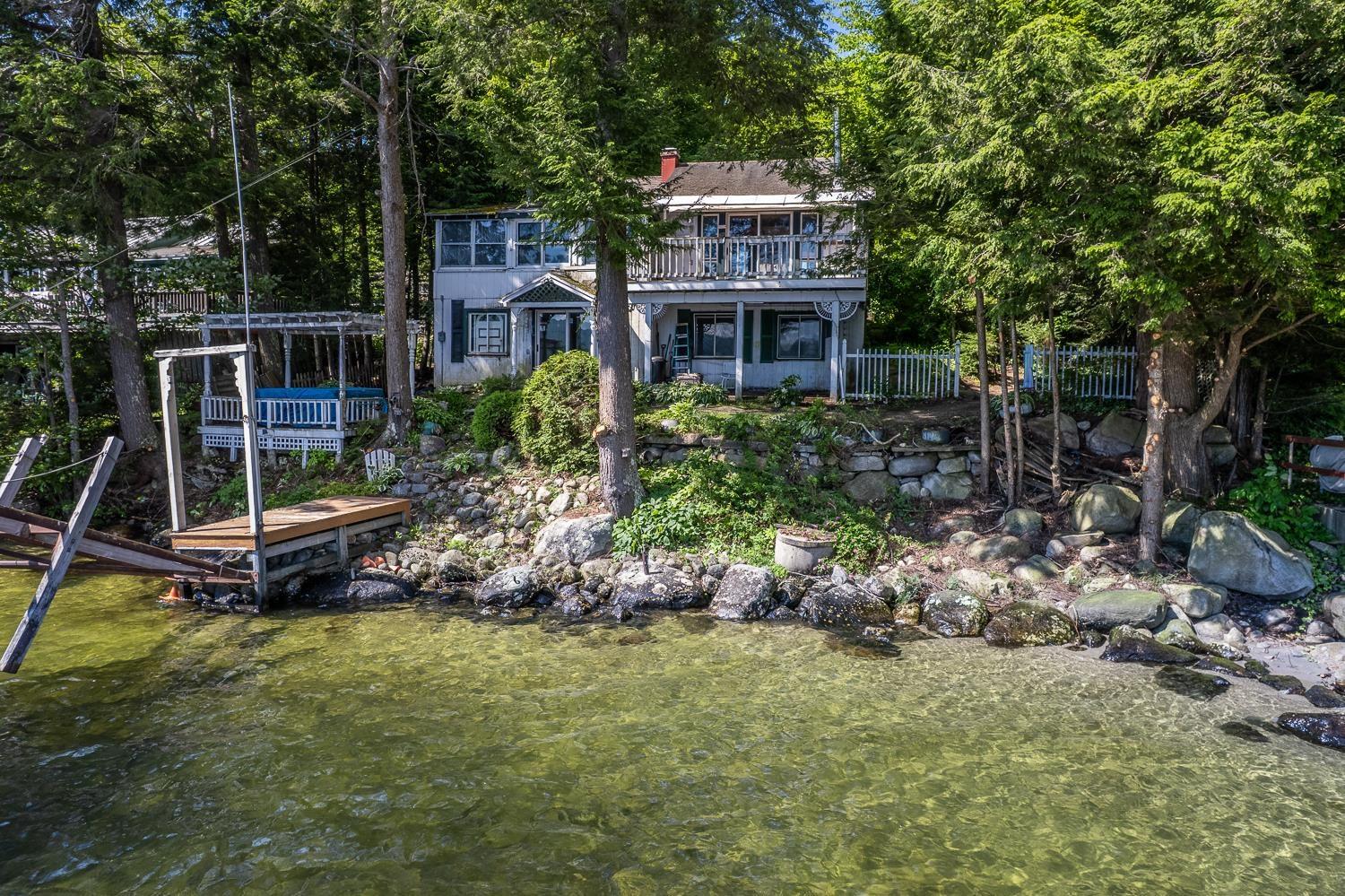 Image 1: Crystal-clear lakefront with pristine water views. Image 1: Crystal-clear lakefront with pristine water views.