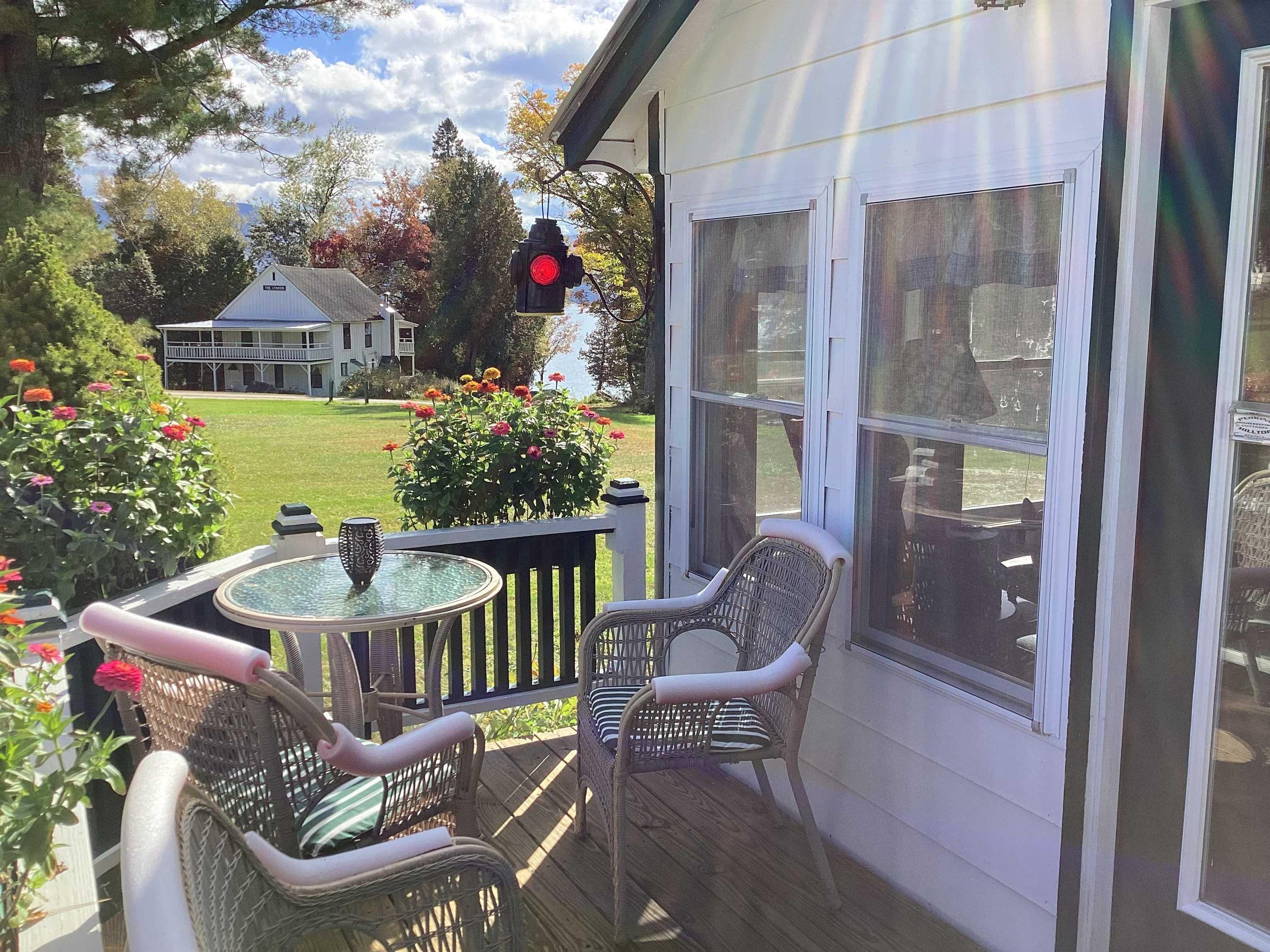Image 3: The porch at the house with a view of the lake