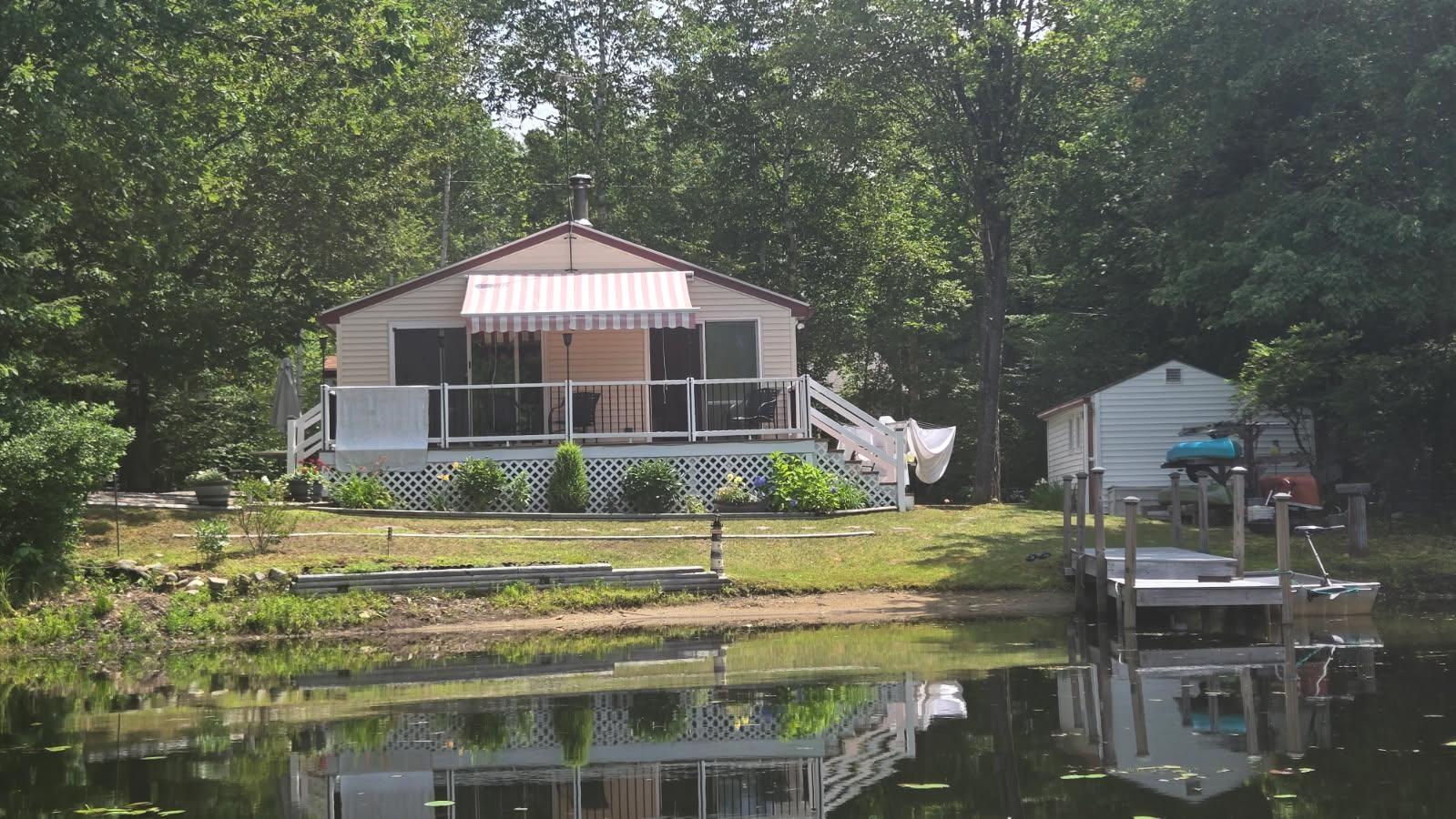 Image 0: View of house from the water
