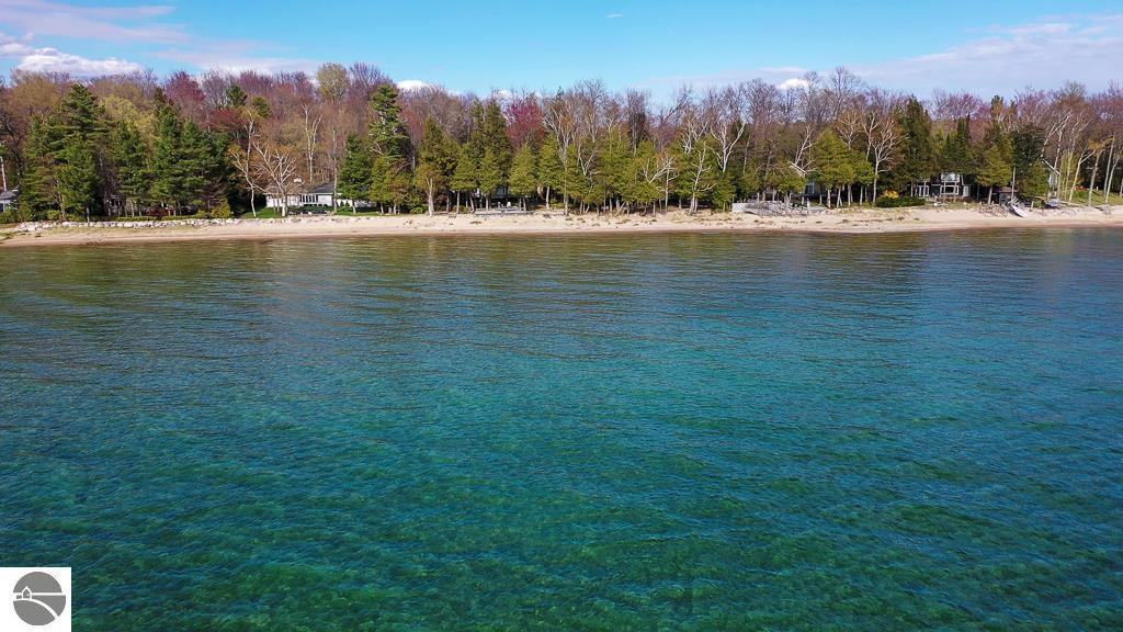 Image 1: On the pristine, sandy shores of Grand Traverse Bay