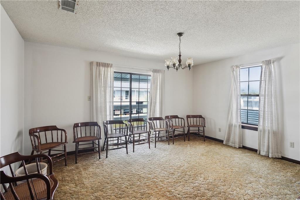 Image 4: Large dining area with deck off the back