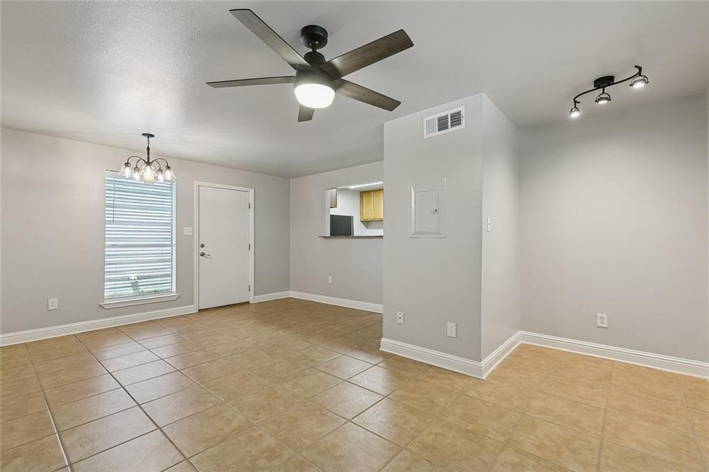 Image 3: view of den facing front door, office nook to the