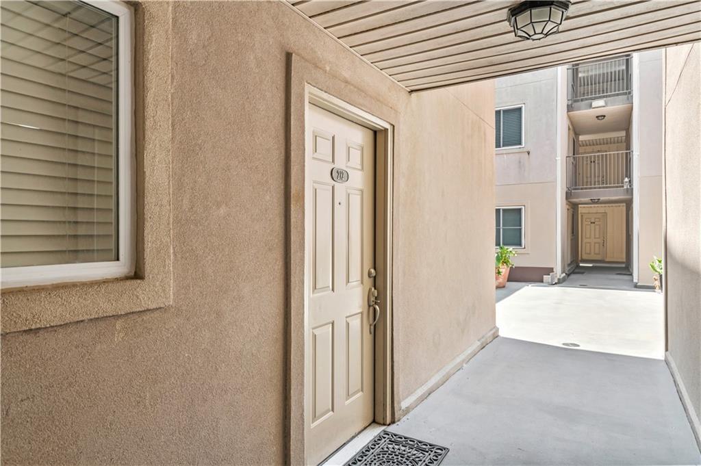 Image 2: Front door to condo