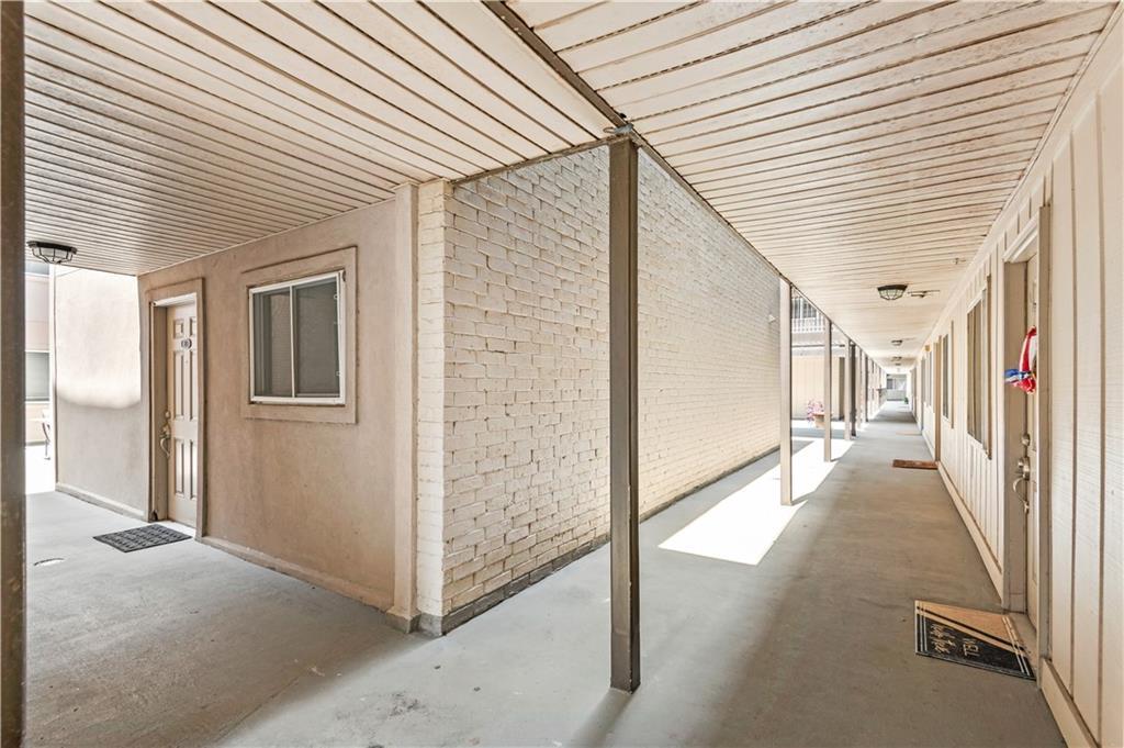 Image 3: Breezeway/Hall to condo