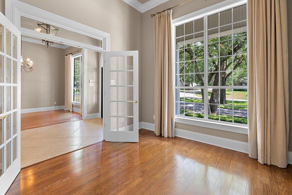 Image 3: OFFICE WITH VIEW TO FRONT YARD.