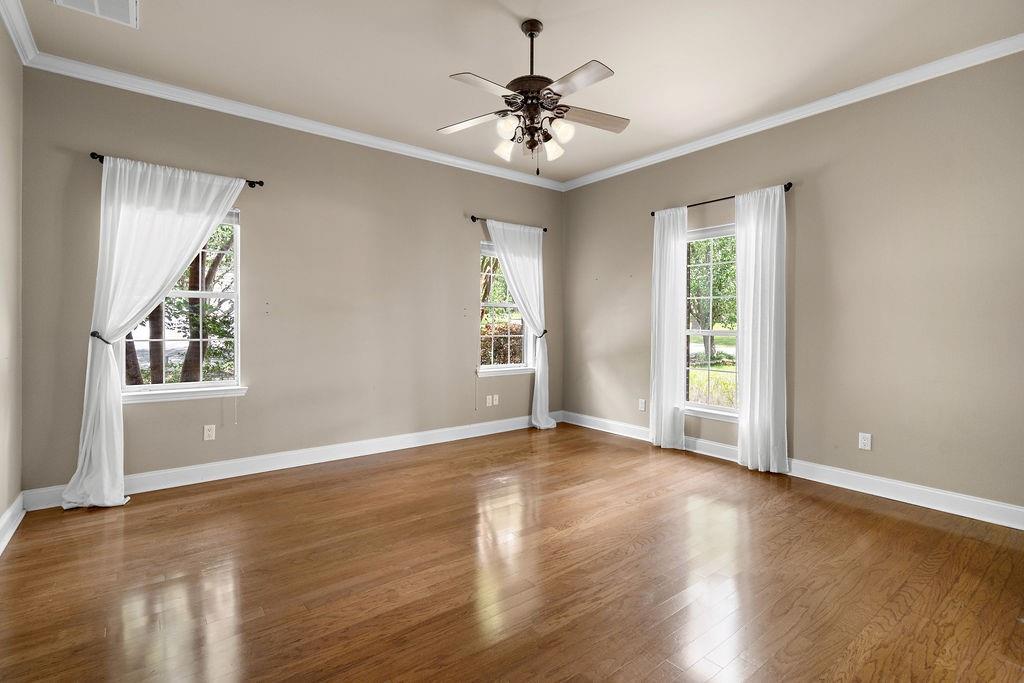 Image 4: PRIMARY BEDROOM/ HARDWOOD FLOORS.