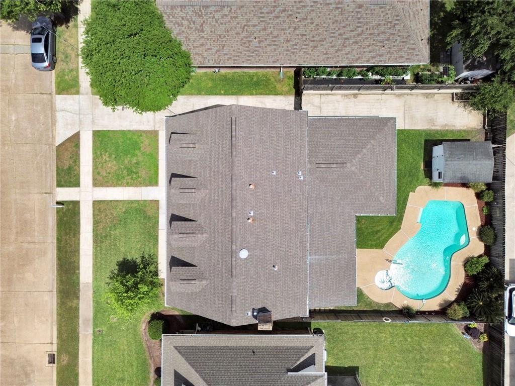 Image 4: Expansive outdoor space with pool, patio, and ampl