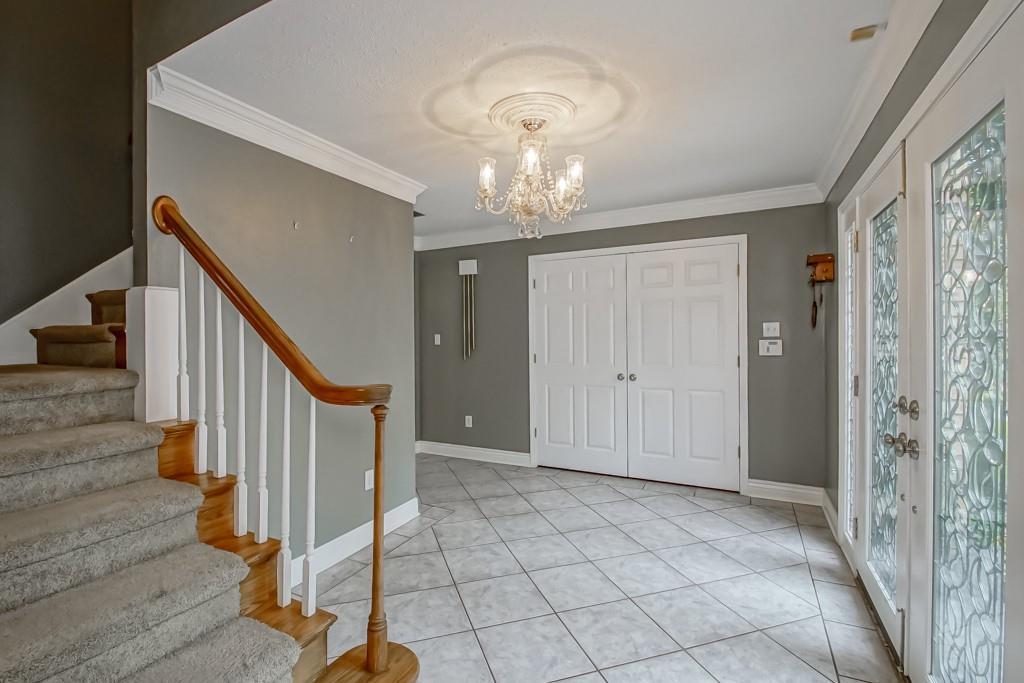 Image 4: Spacious Foyer - Double doors lead to Living Room/