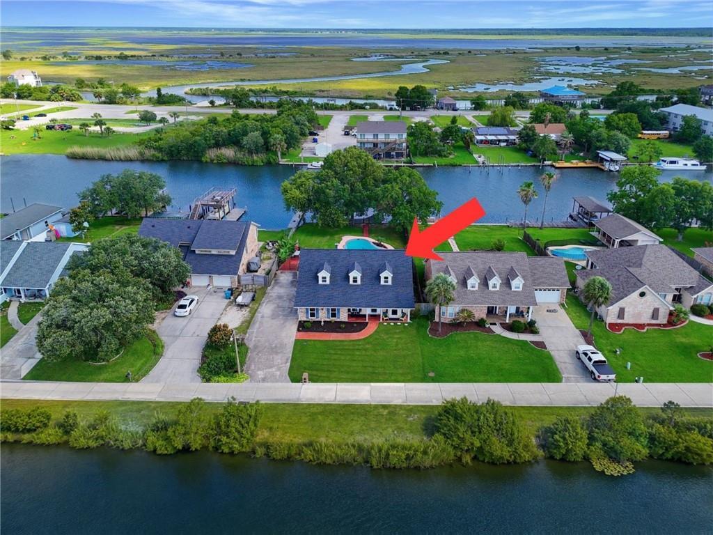 Image 1: Front of home faces Moonraker Lake with unobstruct