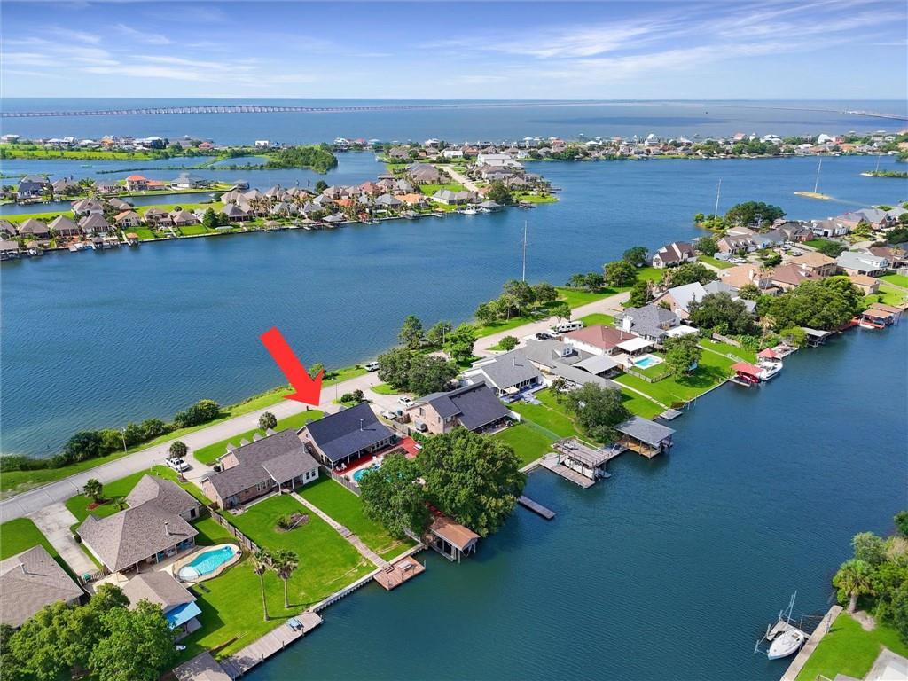 Image 3: Front of home faces Moonraker Lake with unobstruct