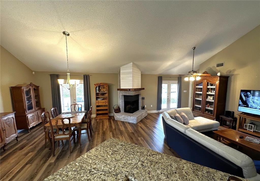 Image 4: Dining/Den Area With Fireplace