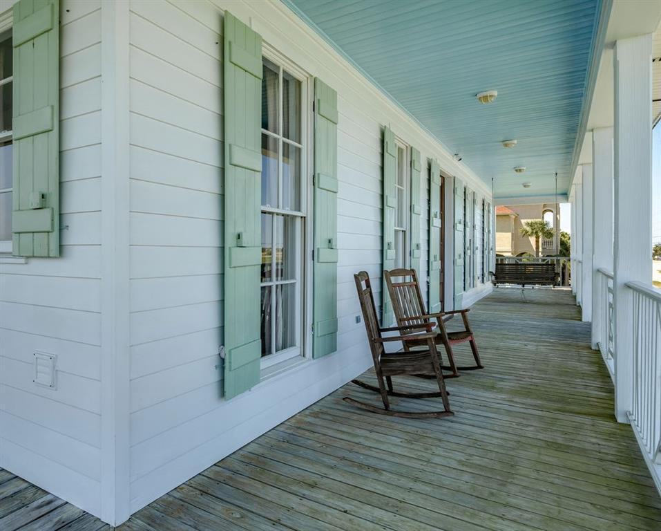 Image 2: Wraparound porch with storm shutters