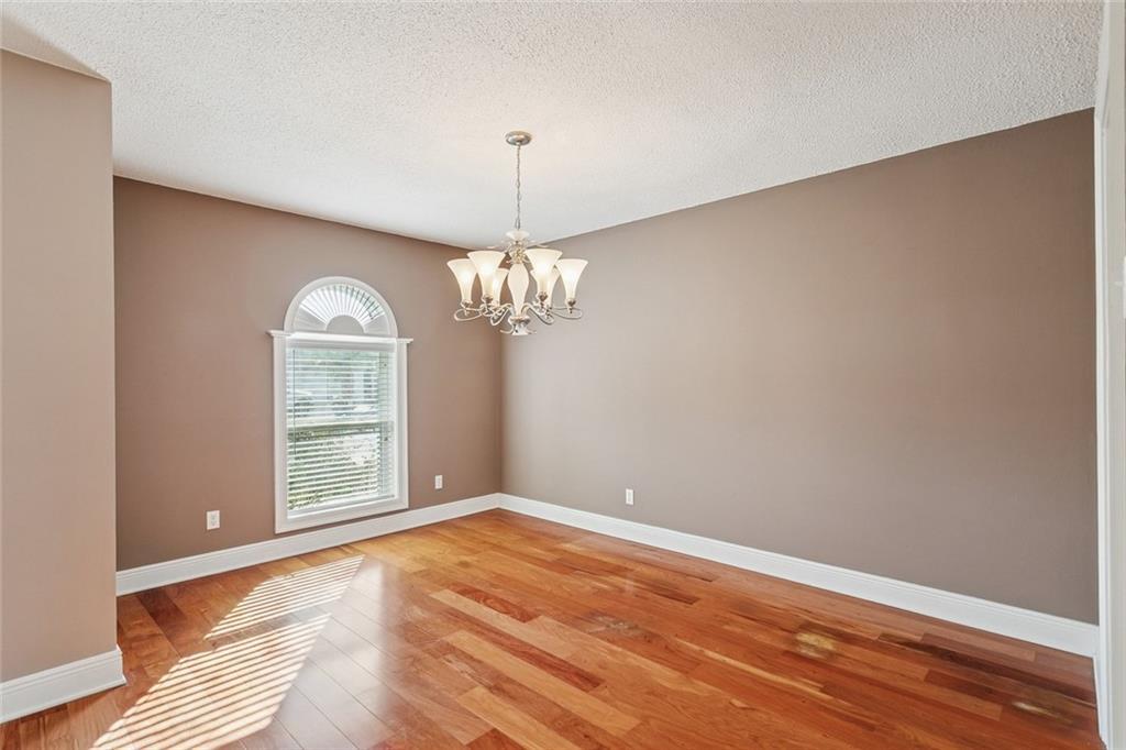 Image 4: Dining room, Rosewood flooring. Custom windows and