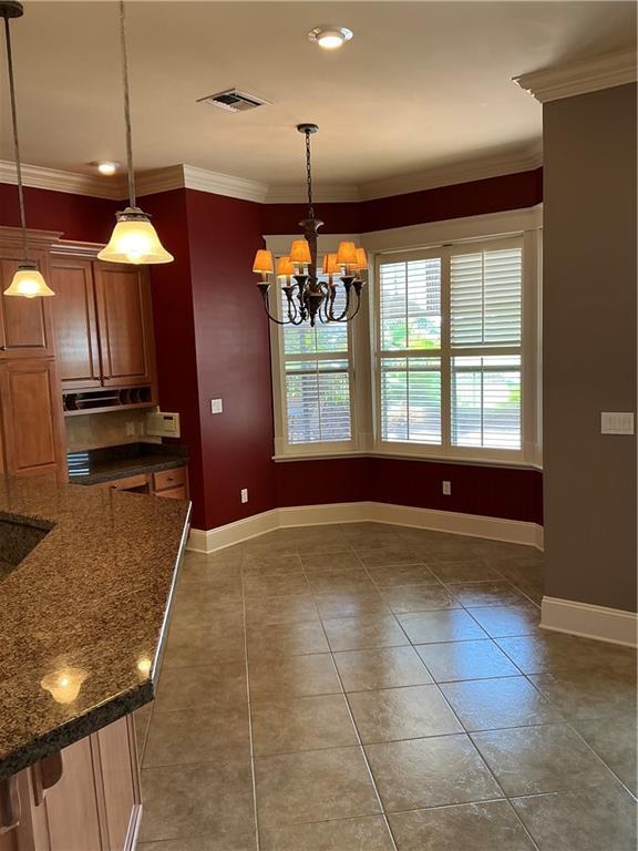 Image 4: Breakfast area off kitchen, view of pool and built