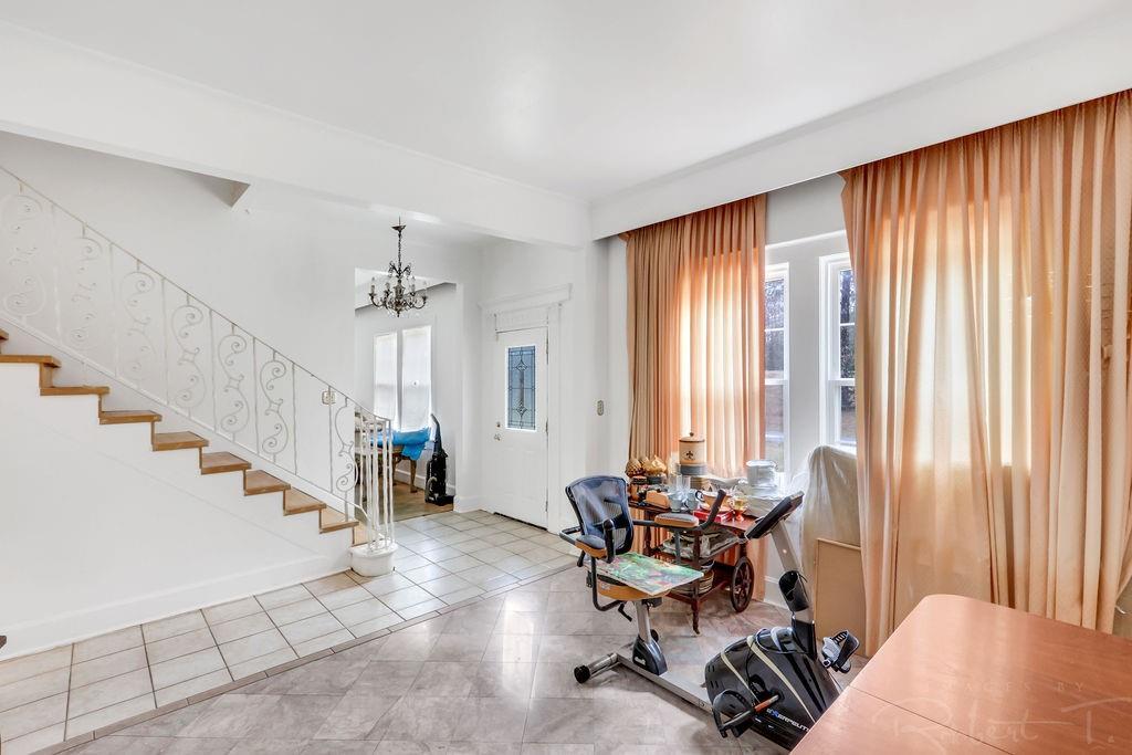 Image 3: Foyer and Living Room