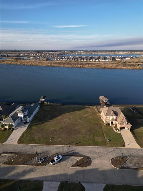 Image 3: Lot is the right half of vacant area-- lot to the