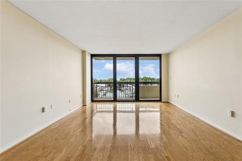 Image 3: Living room leads to private balcony
overlooking