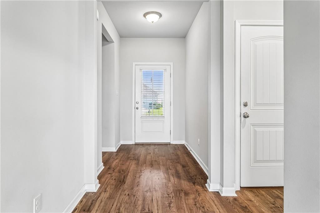 Image 4: Beautiful foyer with wood floors.