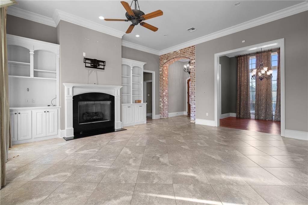 Image 4: Beautiful Fireplace with Built In Cabinets.