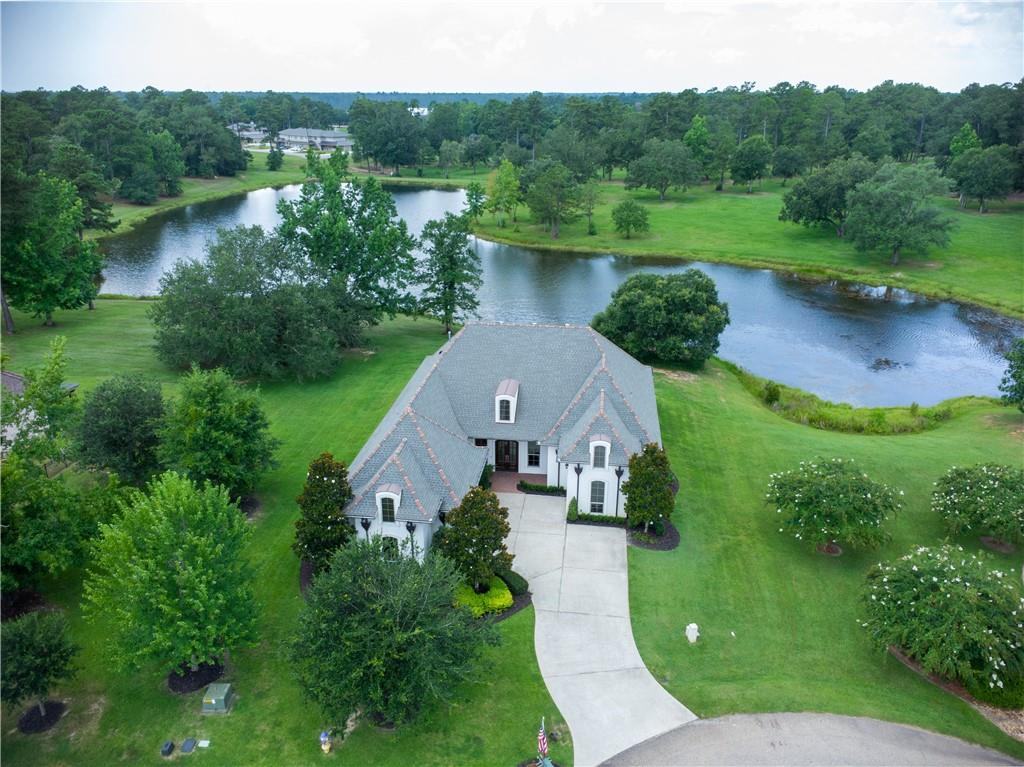 Image 2: AERIAL VIEW SHOWING HOME OVERLOOKING THE LAKE