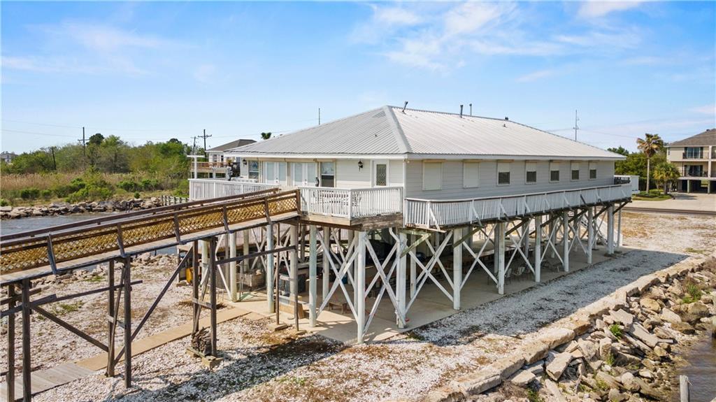 Image 3: Wrap around porch including a back deck that leads