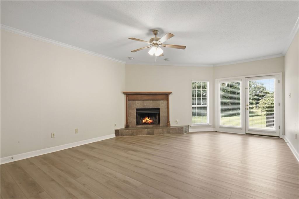 Image 2: Living room with wood burning fireplace