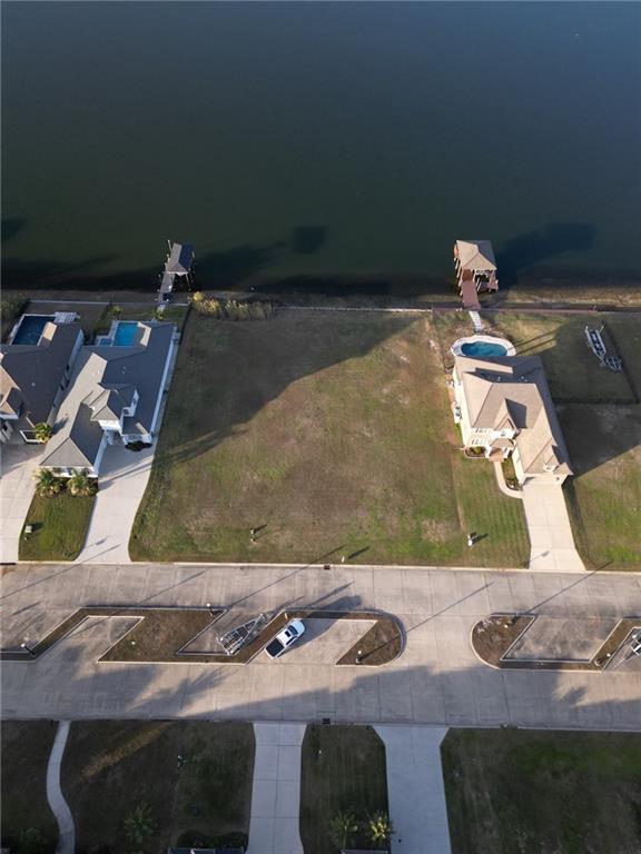 Image 2: Lot is the left half of vacant area-- lot to the r
