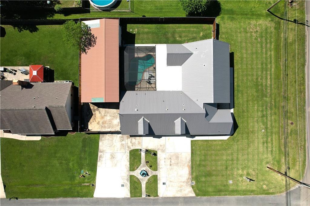 Image 3: Aerial top-down view of 102 S Bayou Estates Dr fea