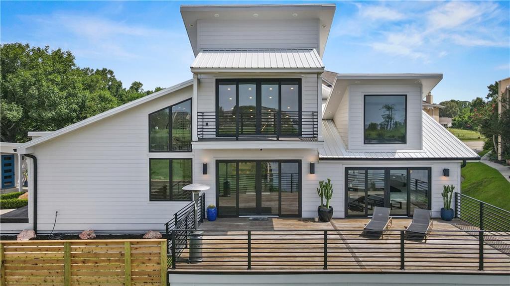 Image 1: Front Elevation. Hardy Plank Siding and Metal Roof