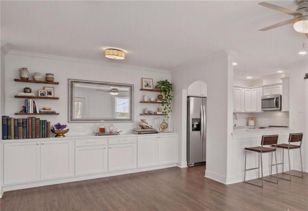 Image 4: Virtually Staged Entrance and Kitchen