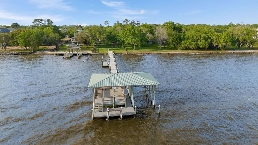 Image 2: Private pier extending to the water with covered d