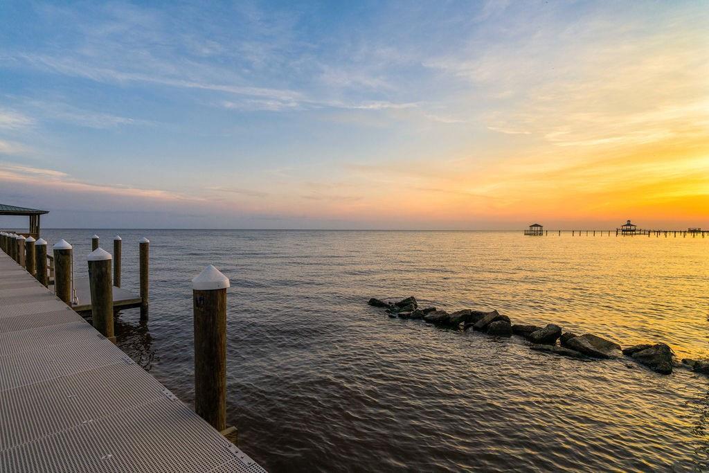 Image 3: Stunning sunset views over the water, showcasing t