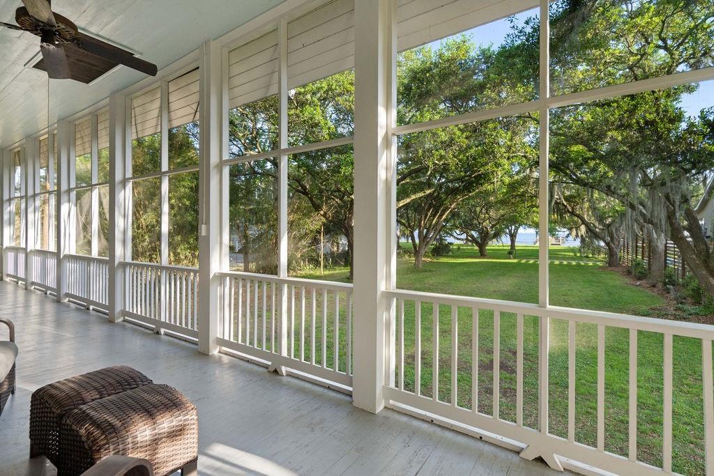 Image 4: Expansive screened porch with ceiling fans and pan