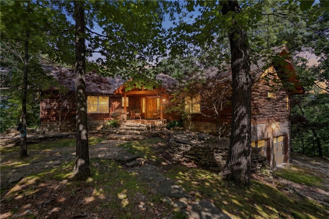 Image 1: Living the Ozark Dream nestled in the trees on top
