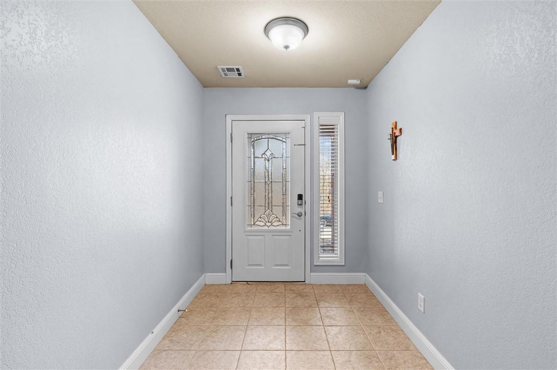 Image 3: Entryway has good space for decor and natural ligh