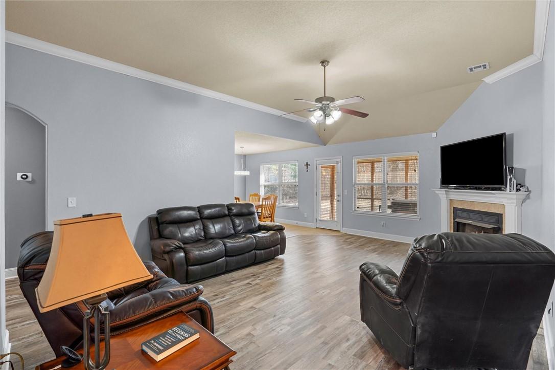 Image 4: Living area featuring high ceiling, crown molding,