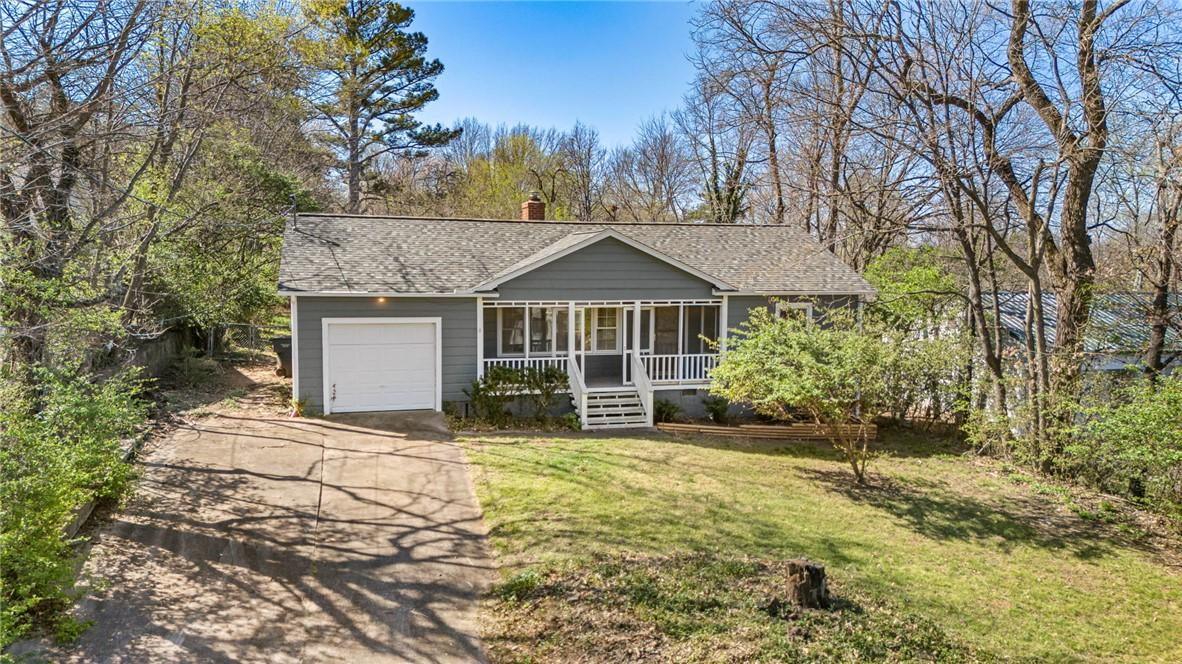 Image 1: Single story home featuring driveway, covered porc