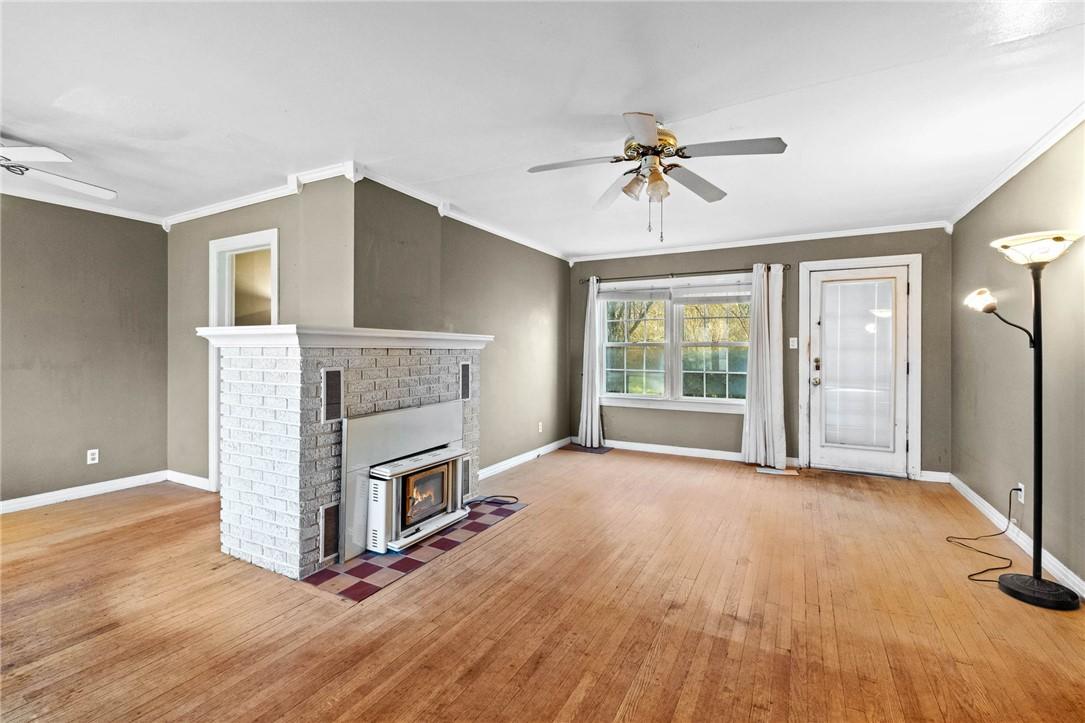 Image 2: Unfurnished living room with ceiling fan, light wo