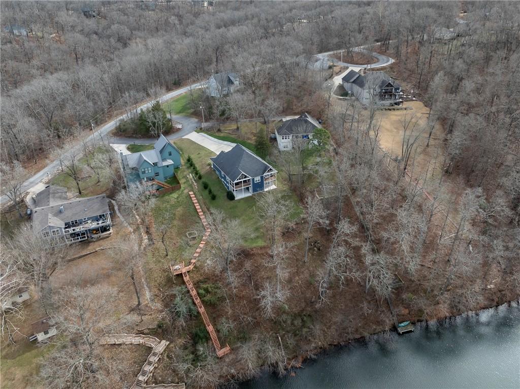 Image 3: Rear aerial showing the home site, backyard and pr