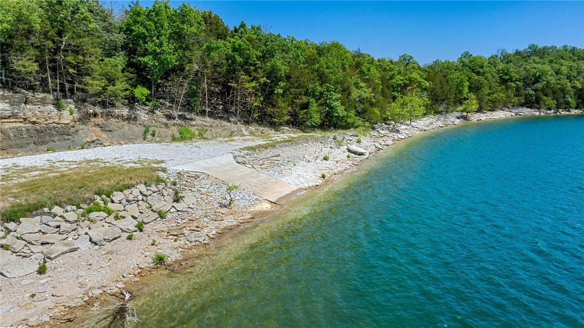 Image 2: Waterfront property featuring a concrete boat ramp